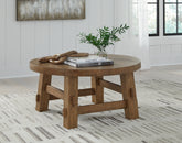 Bay Furniture Gallery - Ashley Furniture - Mackifeld Coffee Table - Round Cocktail Table / Warm Brown - T724-8